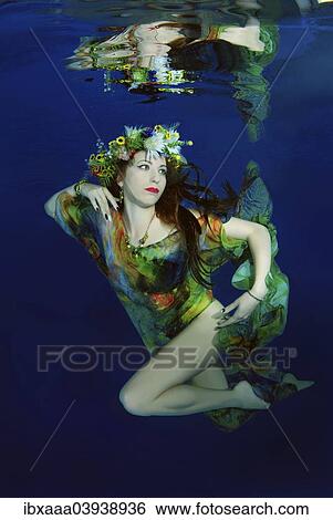 "Woman presenting underwater fashion in a pool, Russia, Europe" View Large Photo Image Stock Photograph - "Woman presenting underwater fashion in a pool, Russia, Europe". Fotosearch
