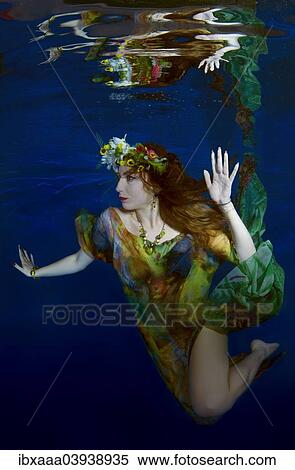 "Woman presenting underwater fashion in a pool, Russia, Europe" View Large Photo Image Stock Photography - "Woman presenting underwater fashion in a pool, Russia, Europe". Fotosearch