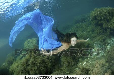 Picture - "Woman presenting underwater fashion, Black Sea, Crimea, Ukraine, Europe". Fotosearch