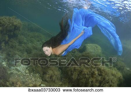 "Woman presenting underwater fashion, Black Sea, Crimea, Ukraine, Europe" View Large Photo Image Stock Image - "Woman presenting underwater fashion, Black Sea, Crimea, Ukraine, Europe". Fotosearch