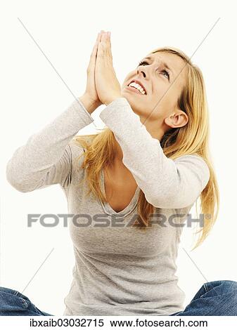 "Woman sitting, begging, pleading" View Large Photo Image Stock Photography - "Woman sitting, begging, pleading". Fotosearch