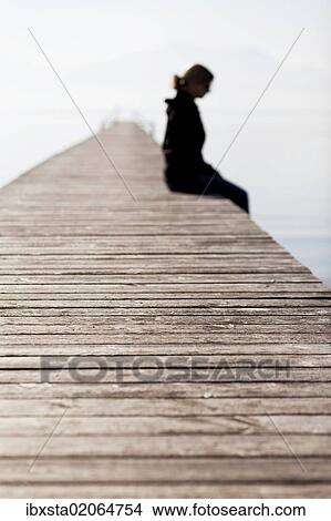 "Woman sitting on a wooden jetty, Chiemsee Lake, Bavaria, Germany, Europe, PublicGround, Europe" View Large Photo Image Picture - "Woman sitting on a wooden jetty, Chiemsee Lake, Bavaria, Germany, Europe, PublicGround, Europe". Fotosearch