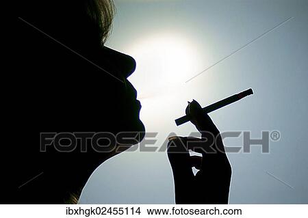 "Woman smoking a cigarette, silhouette" View Large Photo Image Picture - "Woman smoking a cigarette, silhouette". Fotosearch