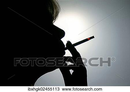 "Woman smoking a cigarette, silhouette" View Large Photo Image Stock Image - "Woman smoking a cigarette, silhouette". Fotosearch