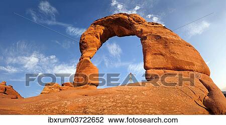 "Woman standing under Delicate Arch natural stone arch, Arches-Nationalpark, near Moab, Utah, United States, North America" View Large Photo Image Stock Image - "Woman standing under Delicate Arch natural stone arch, Arches-Nationalpark, near Moab, Utah, United States, North America". Fotosearch