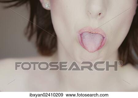 Stock Photo - Woman sticking out her tongue. Fotosearch