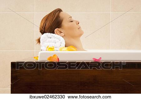Stock Image - Woman taking a bath. Fotosearch
