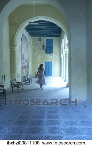 "Woman walking through a portico, Havana, Cuba, North America" View Large Photo Image Stock Photo - "Woman walking through a portico, Havana, Cuba, North America". Fotosearch
