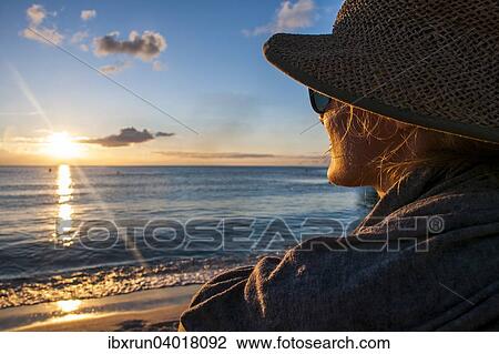 "Woman watching the sunset in Guam, US Territory, Central Pacific" View Large Photo Image Stock Image - "Woman watching the sunset in Guam, US Territory, Central Pacific". Fotosearch