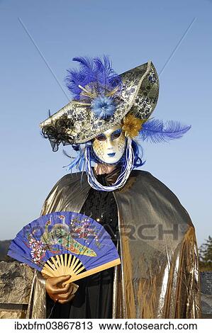 Woman wearing a Venetian mask and a costume View Large Photo Image Stock Image - Woman wearing a Venetian mask and a costume. Fotosearch