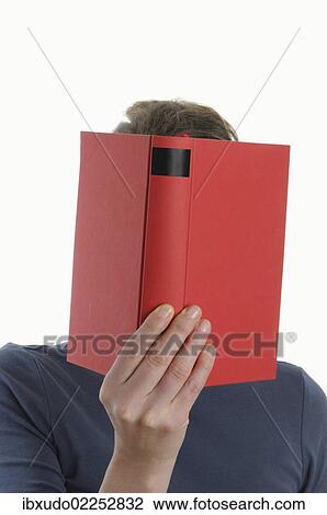 Woman with a red book in front of her face View Large Photo Image Stock Image - Woman with a red book in front of her face. Fotosearch