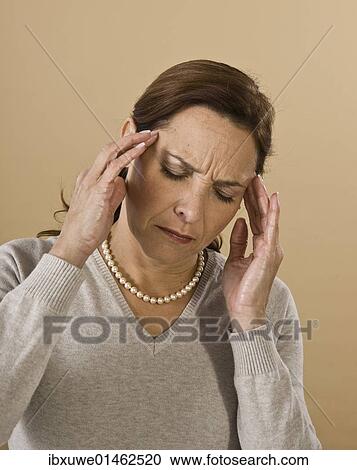Woman with a severe headache View Large Photo Image Stock Image - Woman with a severe headache. Fotosearch