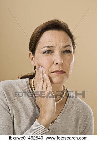 Woman with a severe toothache View Large Photo Image Stock Image - Woman with a severe toothache. Fotosearch