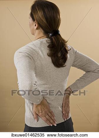 Woman with backache View Large Photo Image Stock Photography - Woman with backache. Fotosearch