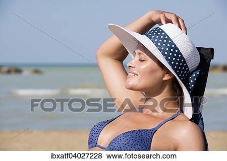 "Woman with bikini and sun hat on the beach, Adriatic, Senigallia, Province of Ancona, Marche, Italy, Europe" View Large Photo Image Stock Photo - "Woman with bikini and sun hat on the beach, Adriatic, Senigallia, Province of Ancona, Marche, Italy, Europe". Fotosearch