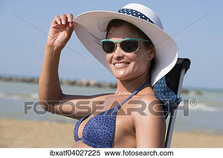 "Woman with bikini, sunglasses and sun hat on the beach, Adriatic, Senigallia, Province of Ancona, Marche, Italy, Europe" View Large Photo Image Stock Photography - "Woman with bikini, sunglasses and sun hat on the beach, Adriatic, Senigallia, Province of Ancona, Marche, Italy, Europe". Fotosearch
