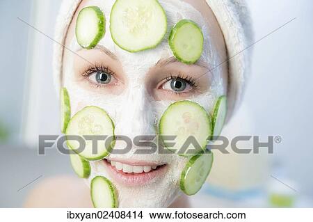 "Woman, with cucumber slices on a facial mask" View Large Photo Image Picture - "Woman, with cucumber slices on a facial mask". Fotosearch
