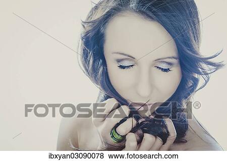Stock Photo - Woman with eyes closed. Fotosearch