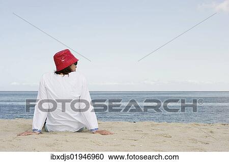 "Woman with red hat on the beach, List, Sylt island, Schleswig-Holstein, Germany, Europe" View Large Photo Image Stock Image - "Woman with red hat on the beach, List, Sylt island, Schleswig-Holstein, Germany, Europe". Fotosearch