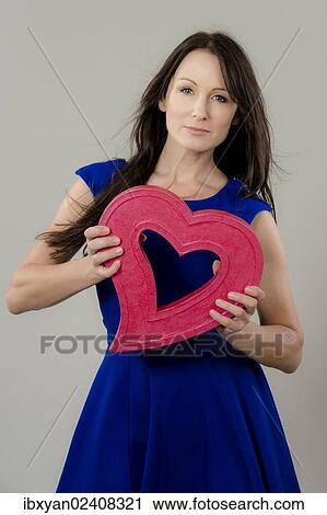 Women holding a heart View Large Photo Image Stock Image - Women holding a heart. Fotosearch