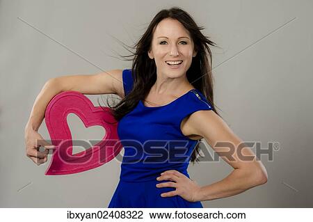 Women holding a heart View Large Photo Image Stock Image - Women holding a heart. Fotosearch