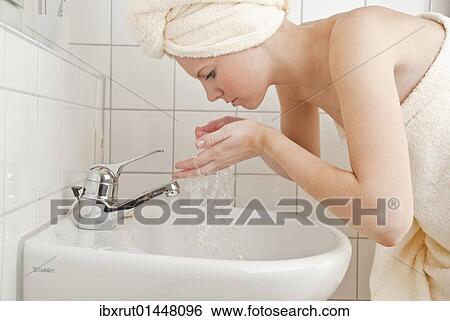 Women washing her face with water View Large Photo Image Stock Photograph - Women washing her face with water. Fotosearch