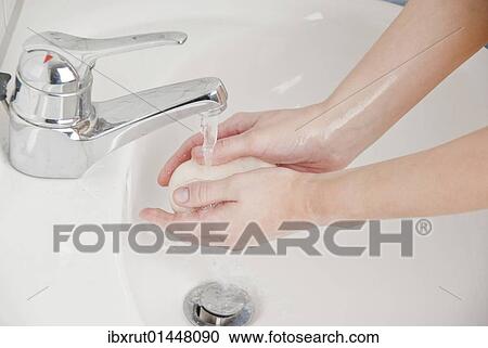 Women washing her hands with soap View Large Photo Image Stock Image - Women washing her hands with soap. Fotosearch