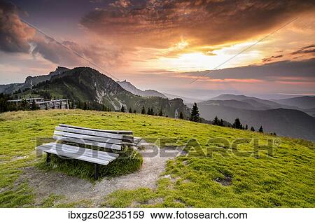 Stock Photo - "Wooden bench on the summit of Mt Brauneck, Bavaria, Germany, Europe". Fotosearch