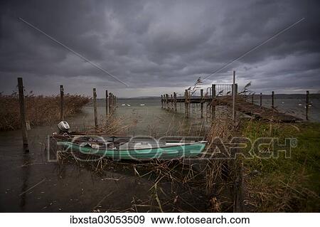 "Wooden boat beside a jetty on Lake Constance, Lake Constanz, Triboltingen, Canton of Thurgau, Switzerland, Europe" View Large Photo Image Stock Photo - "Wooden boat beside a jetty on Lake Constance, Lake Constanz, Triboltingen, Canton of Thurgau, Switzerland, Europe". Fotosearch