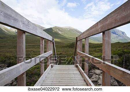 "Wooden bridge over Allt Dearg Mor with a view towards Glen Sligachan, Isle of Skye, Scotland, United Kingdom, Europe" View Large Photo Image Stock Image - "Wooden bridge over Allt Dearg Mor with a view towards Glen Sligachan, Isle of Skye, Scotland, United Kingdom, Europe". Fotosearch