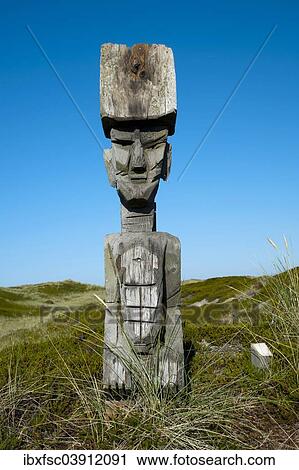"Wooden figure in the dunes, Rantum, Sylt, Schleswig-Holstein, Germany, Europe" View Large Photo Image Stock Image - "Wooden figure in the dunes, Rantum, Sylt, Schleswig-Holstein, Germany, Europe". Fotosearch