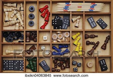 "Wooden figures of board games, gaming pieces, dice, dominoes, Mikado sticks, games collection in a letter case" View Large Photo Image Stock Photography - "Wooden figures of board games, gaming pieces, dice, dominoes, Mikado sticks, games collection in a letter case". Fotosearch