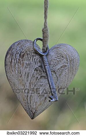 Wooden heart with a key View Large Photo Image Stock Image - Wooden heart with a key. Fotosearch