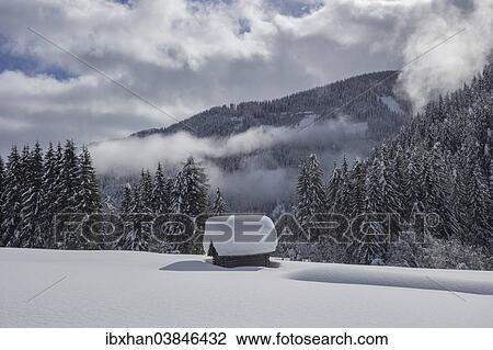 "Wooden hut covered with a lot of snow, Obertilliach, Lesachtal valley, East Tyrol, Austria, Europe" View Large Photo Image Stock Image - "Wooden hut covered with a lot of snow, Obertilliach, Lesachtal valley, East Tyrol, Austria, Europe". Fotosearch