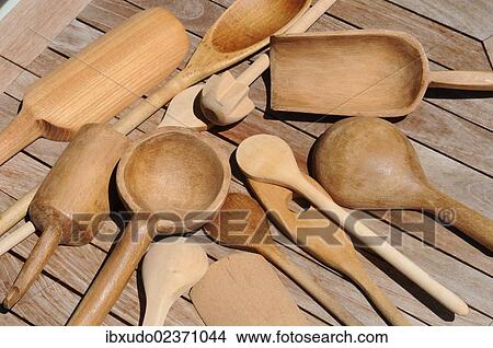 Picture - Wooden spoons lying on a wooden table. Fotosearch
