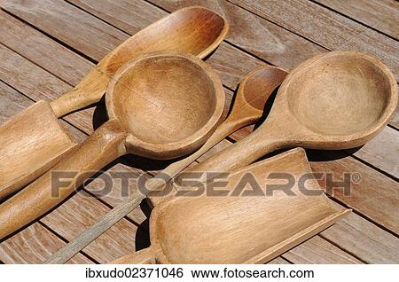 Wooden spoons lying on a wooden table View Large Photo Image Stock Photograph - Wooden spoons lying on a wooden table. Fotosearch