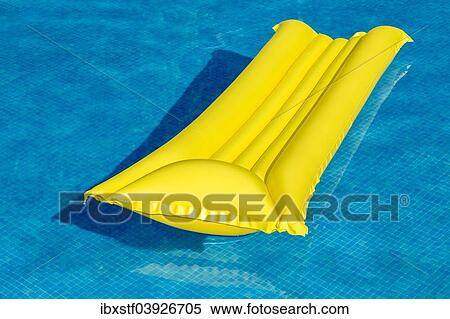 "Yellow lilo, in a swimming pool" View Large Photo Image Stock Photography - "Yellow lilo, in a swimming pool". Fotosearch