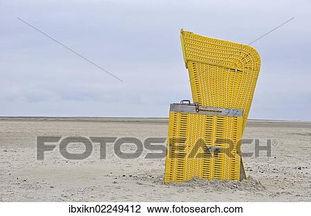 "Yellow roofed wicker beach chair, beach on the North Sea, St. Peter-Ording, Schleswig-Holstein, Germany, Europe" View Large Photo Image Stock Image - "Yellow roofed wicker beach chair, beach on the North Sea, St. Peter-Ording, Schleswig-Holstein, Germany, Europe". Fotosearch