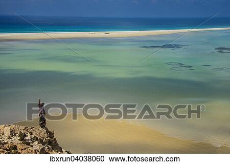"Yemenite man overlooking the Detwah lagoon, near Qalansia, Socotra, Yemen, Asia" View Large Photo Image Stock Image - "Yemenite man overlooking the Detwah lagoon, near Qalansia, Socotra, Yemen, Asia". Fotosearch