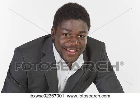 "Young black man in a suit, portrait" View Large Photo Image Stock Image - "Young black man in a suit, portrait". Fotosearch