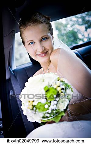 Stock Photo - Young bride in the car. Fotosearch