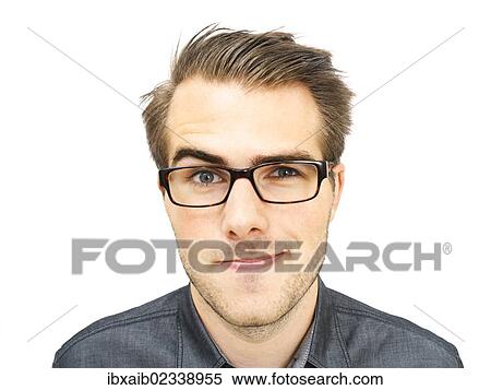 Stock Photography - "Young businessman wearing glasses, portrait, sly glance". Fotosearch