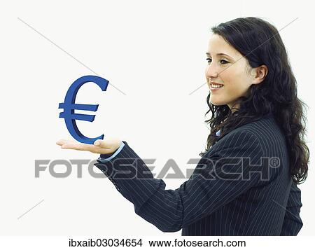 Young businesswoman holding an euro sign View Large Photo Image Picture - Young businesswoman holding an euro sign. Fotosearch