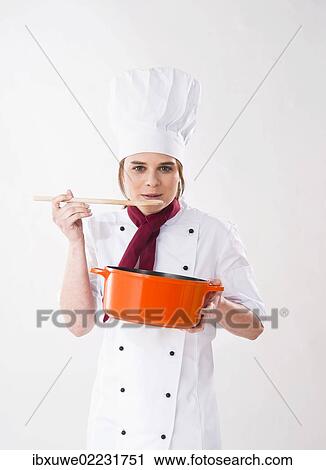 Young chef holding a pot and a wooden spoon View Large Photo Image Stock Image - Young chef holding a pot and a wooden spoon. Fotosearch