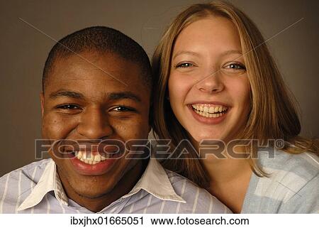 "Young couple, black and white skin color, African and European, teenagers laughing" View Large Photo Image Stock Image - "Young couple, black and white skin color, African and European, teenagers laughing". Fotosearch