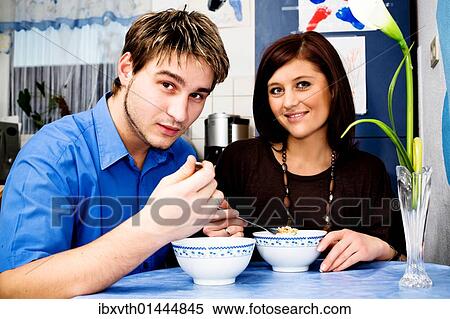 Young couple in the kitchen View Large Photo Image Stock Photography - Young couple in the kitchen. Fotosearch