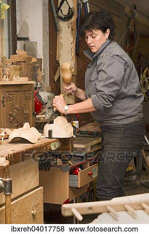 "Young farmer carving traditional masks, Sprenger family farm, Schwaz District, Tyrol Family, Austria, Europe" View Large Photo Image Stock Photo - "Young farmer carving traditional masks, Sprenger family farm, Schwaz District, Tyrol Family, Austria, Europe". Fotosearch