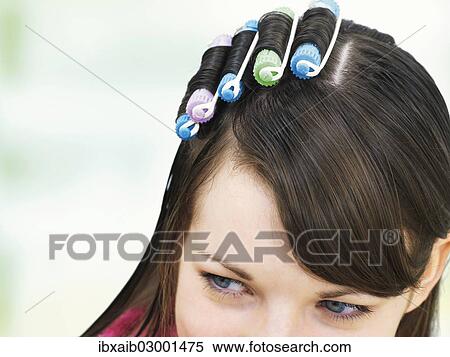 Young girl with curlers in her hair View Large Photo Image Stock Photography - Young girl with curlers in her hair. Fotosearch