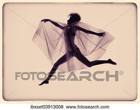 Stock Photo - Young jumping woman with wing veil. Fotosearch