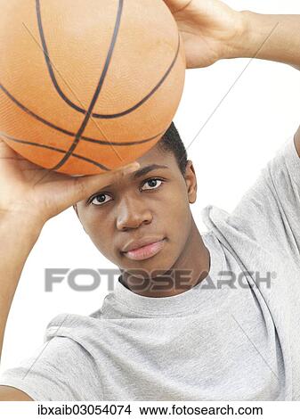 Young male playing basketball View Large Photo Image Picture - Young male playing basketball. Fotosearch